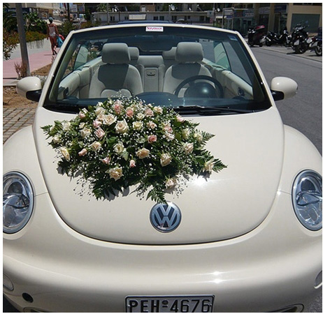 รถแต่งงานสีขาว ประดับดอกไม้